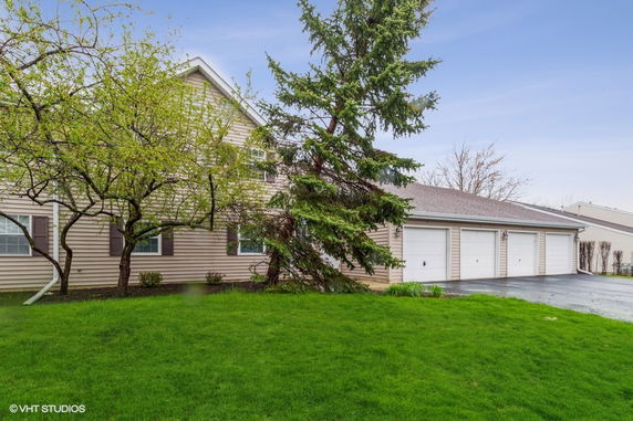 Front view of a house with multiple garage doors.
