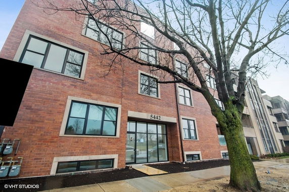 Front view of a multi-story brick building.