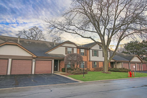 Front view of a two-story house with attached garages.