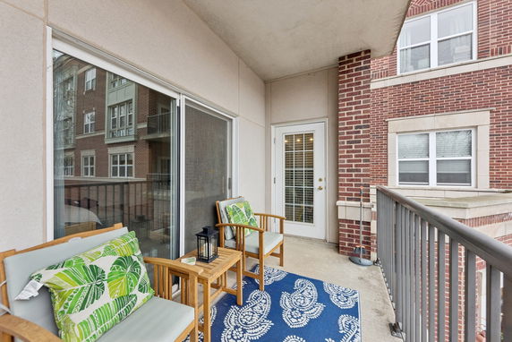 View from a balcony with railings and outdoor seating.
