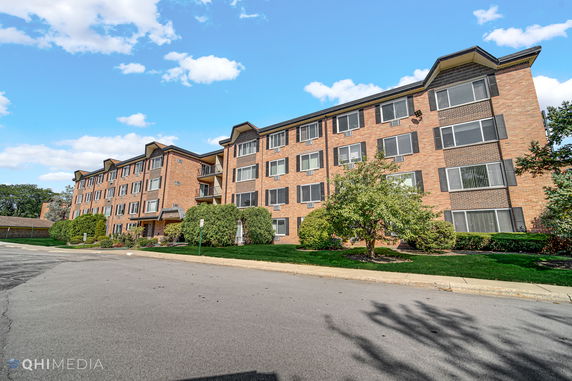 Front view of a multi-story brick apartment building