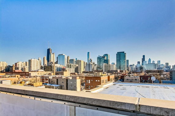 Panoramic view of a city skyline with tall buildings.
