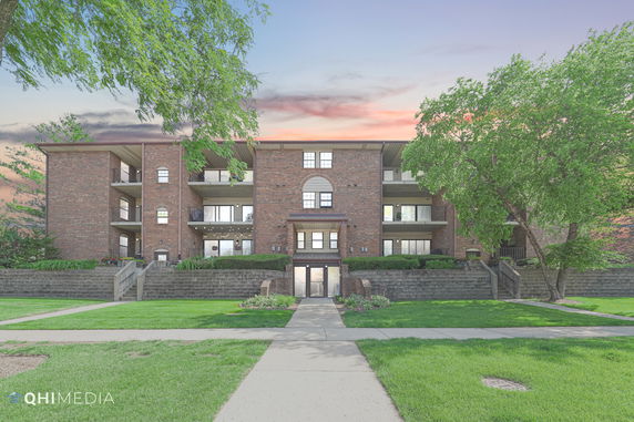 Front view of a multi-story brick residential building.