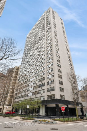 Front view of a high-rise building with numerous windows.