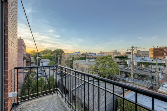 Panoramic view of surrounding buildings from a balcony.