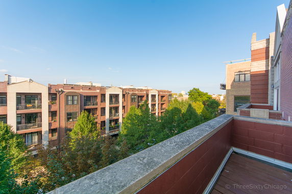 View of surrounding apartment buildings from a rooftop.