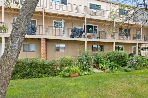 Front view of a multi-story residential building with balconies.