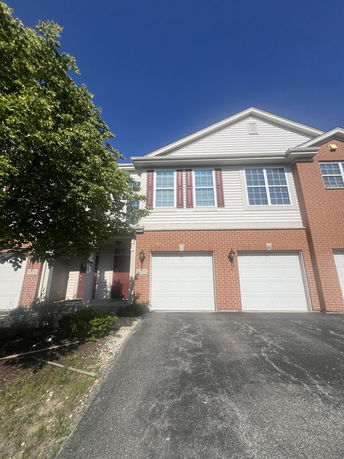Front view of a two-story house with a double garage.