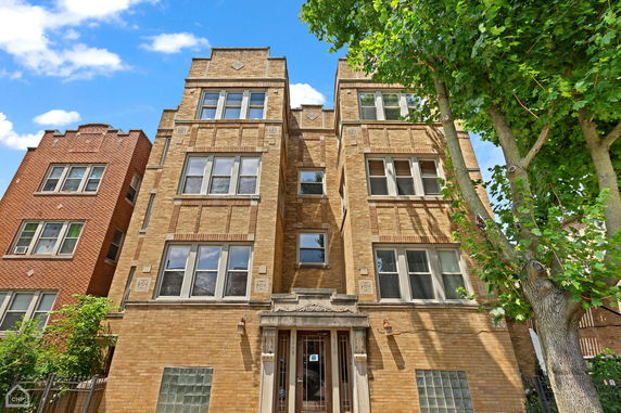 Front view of a multi-story brick building.