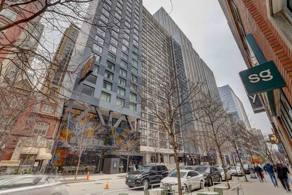 Front view of a multi-story hotel building in an urban area.