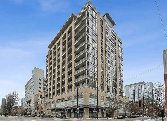 Front view of a multi-story modern apartment building.