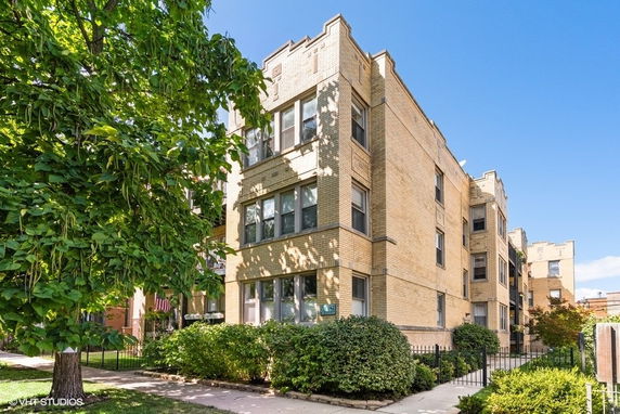 Front view of a multi-story brick apartment building