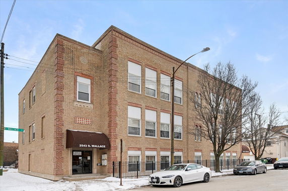 Front view of a multi-story brick building.