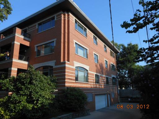 Front view of a multi-story brick building.
