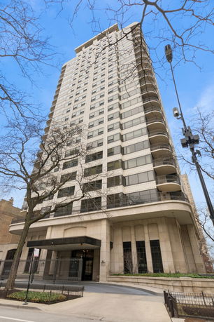 View of a high-rise building with multiple floors and balconies.