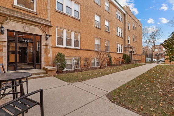 Front view of a multi-story brick apartment building