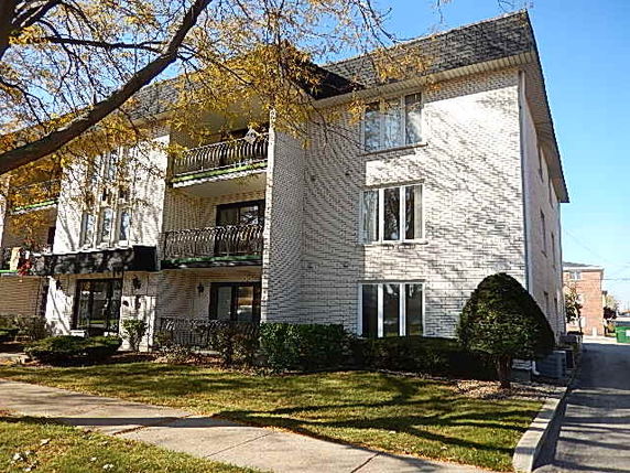 Front view of a multi-story residential building.