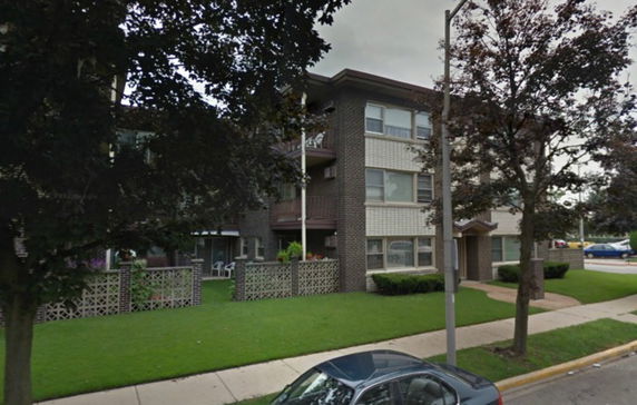 Front view of a three-story apartment building.