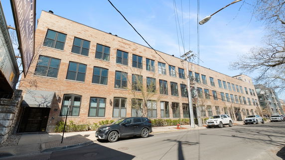 Front view of a multi-story brick building.