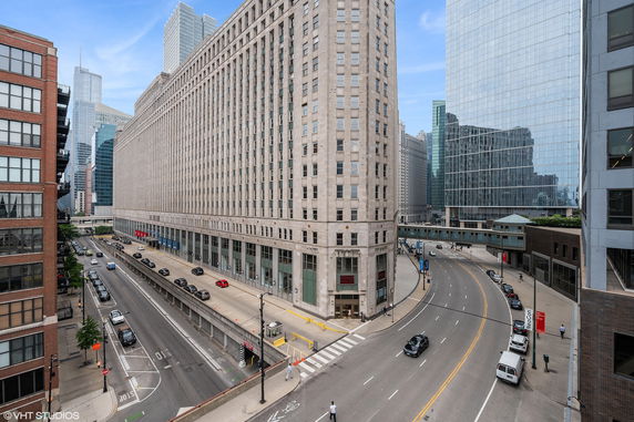 Front view of a large multi-story building in an urban area.