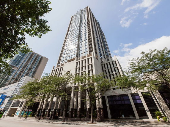 Front view of a high-rise building with modern architecture.