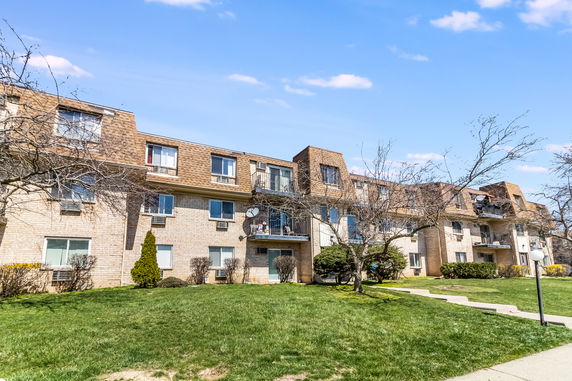 Front view of a multi-story apartment building.