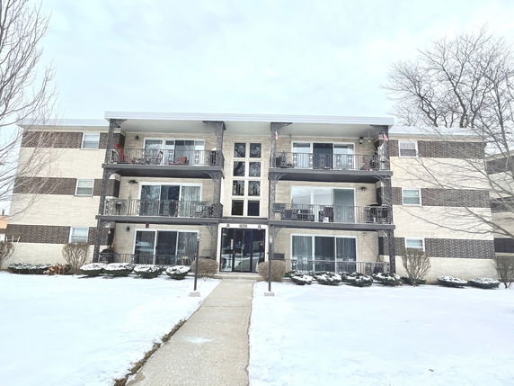 Front view of a multi-story apartment building.