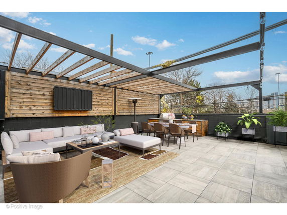 Rooftop with seating area and dining setup under pergola.