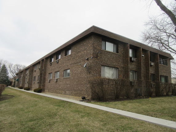 Front view of a two-story brick apartment building