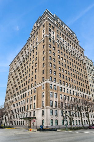 Front view of a multi-story brick building.