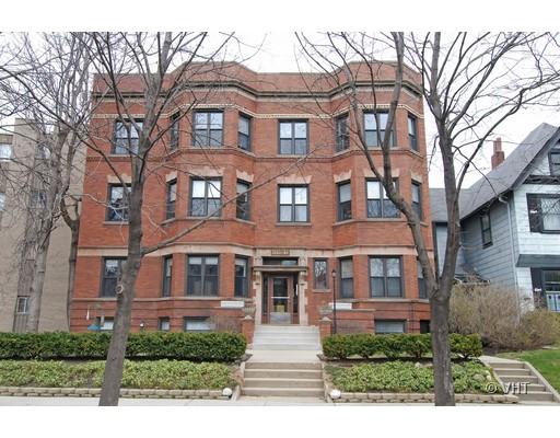 Front view of a three-story brick apartment building.