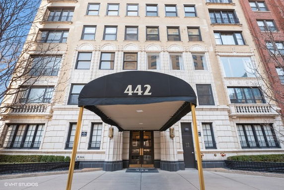 Front view of a multi-story building with entrance canopy labeled 442.