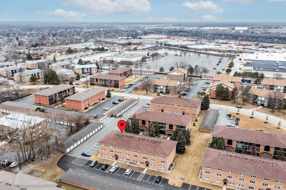 Aerial panoramic view of residential apartment buildings in a suburban area.