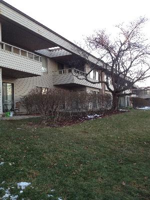 Front view of a two-story building with balconies.