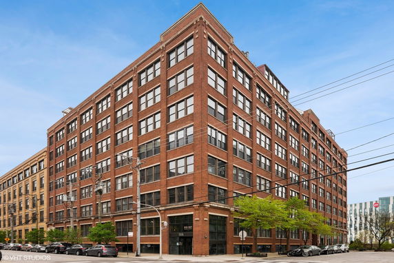 Front view of a multi-story brick building.