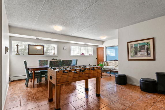 Indoor room with a foosball table and seating area.