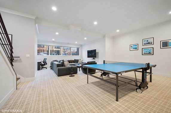 Indoor recreation area with a ping pong table and seating