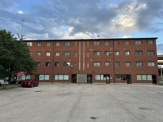 Front view of a three-story brick building