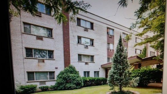 Front view of a multi-story apartment building.