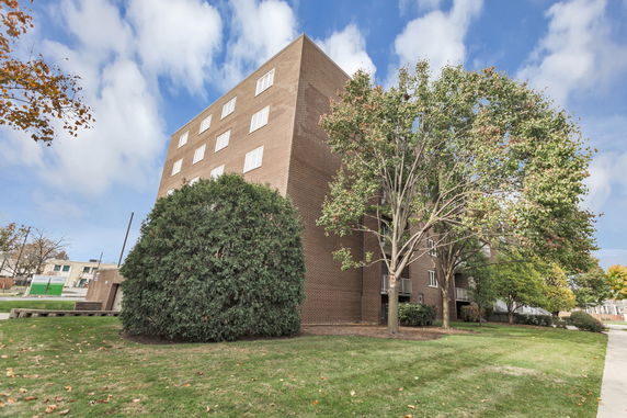 Front view of a multi-story brick building.