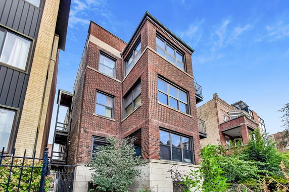 Front view of a multi-story brick building