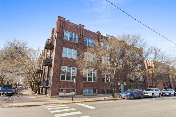 Front view of a four-story brick building.