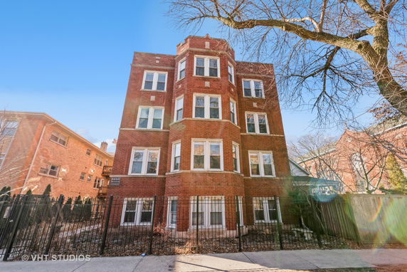 Front view of a multi-story brick building.