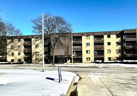 Front view of a multi-story apartment building.