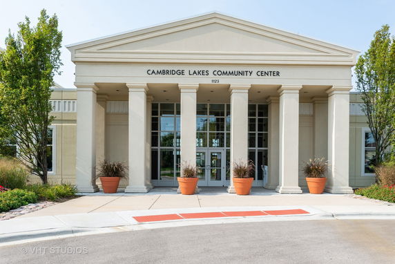 Front view of a community center with large columns and entrance.