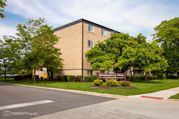 Front view of a three-story condominium building.