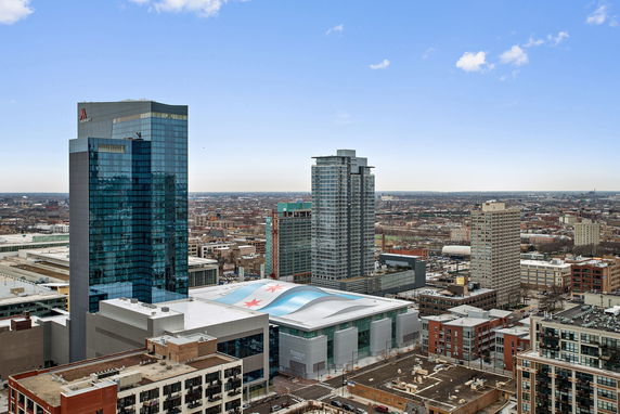 Panoramic view of multiple high-rise buildings in a cityscape.