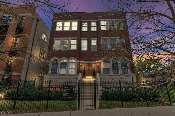 Front view of a three-story brick building.