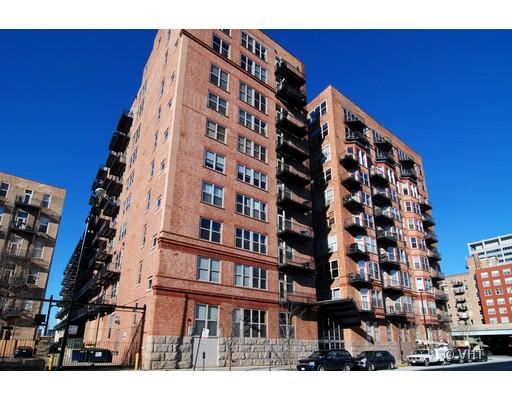 Front view of a multi-story brick apartment building.