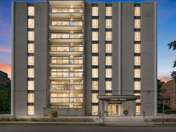 Front view of a multi-story apartment building with balconies and a main entrance labeled 'Lakeview Terrace.'